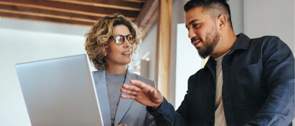 People working together in-front of a computer