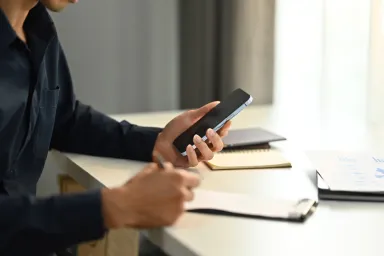 Close up of person working on a phone
