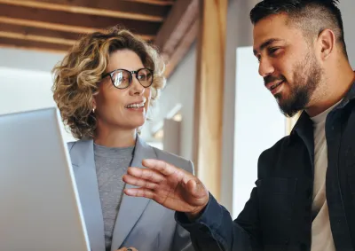 People working together in-front of a computer